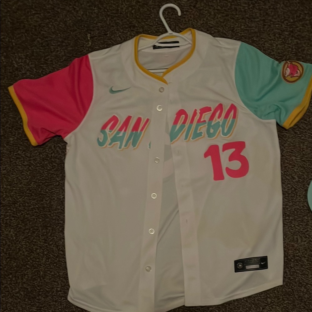 White and Pink Baseball Jersey with Teal SAN DIEGO Text and Number 13
